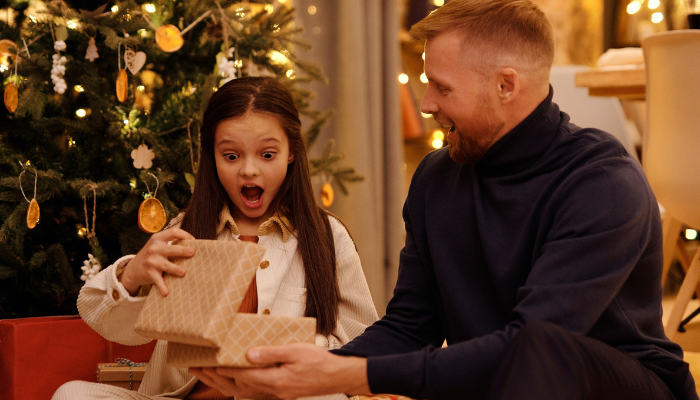 Kid opening Christmas Eve box