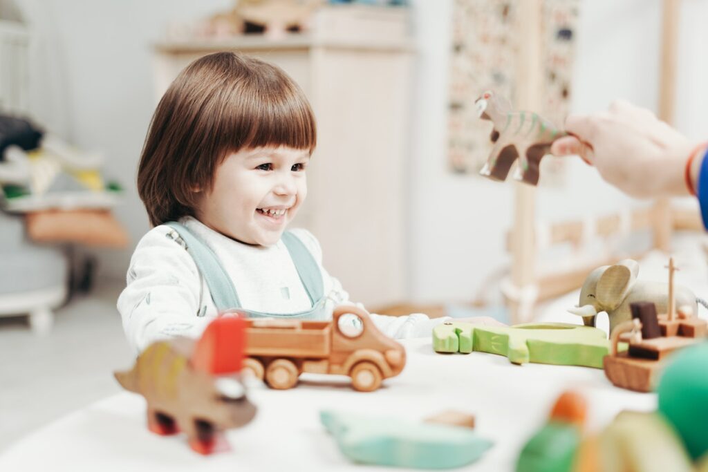 child playing with retro toys