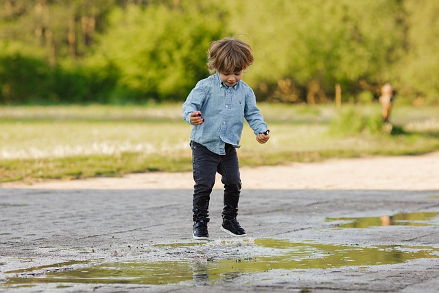 kids jumping in puddles